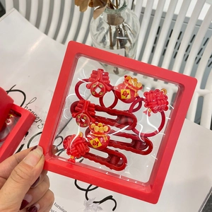 Chinese New Year festive red hair clip gift set with lucky knots and fortune bag charms
