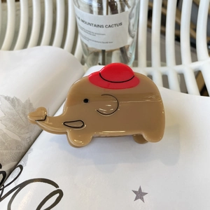 Pinza per capelli a elefante in acetato marrone con simpatico cappello rosso
