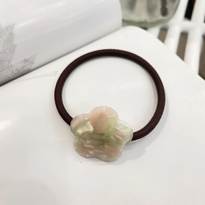 Close-up of pink and green gradient flower charm with France Handmade engraving