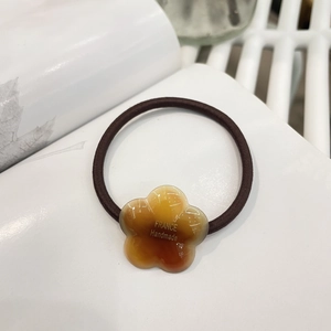 Elegant amber flower hair tie with handmade resin floral charm and coffee elastic cord
