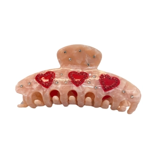 Pinza per capelli in acetato rosa con cuori di strass rossi e cristalli bianchi