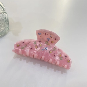 Pink acetate hair claw clip with colorful rhinestone flowers for elegant hairstyles