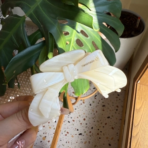 Elegant cream white marble acetate hair claw clip with a stylish handmade bow design