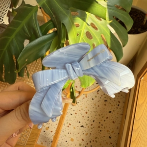 Handmade light blue marble acetate hair claw clip with an elegant 3D bow design