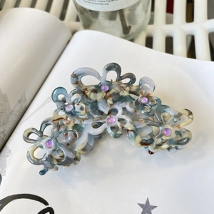 Eleganter Haarclip aus Acetat mit farbigem Marmormuster und violettem Strassstein-Akzent
