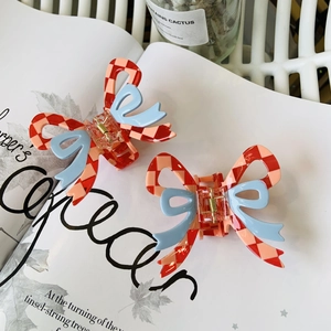 Pink checkered bow claw clips for women featuring a sweet blue ribbon design