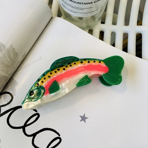 Detailed view of rainbow trout acetate hair claw clip showing colorful texture and glossy finish