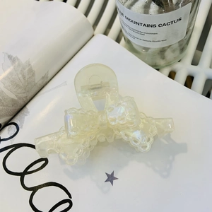 Eleganter Haarklammer aus Acetat in Creme mit Spitzen-Schleifen-Design für süße Stylings