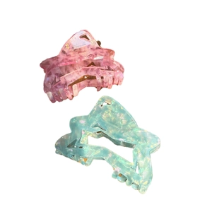 Star-shaped acetic acid hair claws with colorful marble texture and hollow star design