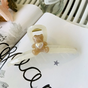 Cute cream bear hair claw clip with heart detail and elegant matte finish for women