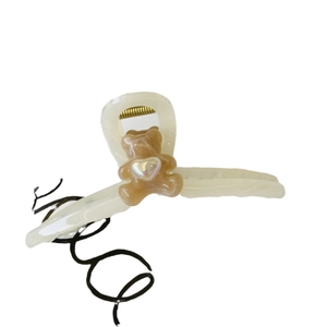 Large cream hair claw clip with cute brown bear and heart detail for women's styling