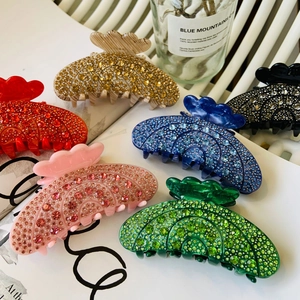 Detailed collection of crystal-studded acetate hair claws in six vibrant luxury colors