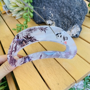 Detail of acrylic hair claw clip with Chinese ink bamboo patterns and calligraphy text