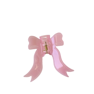 Pince à cheveux nœud rose clair élégante avec finition brillante et ressort en métal