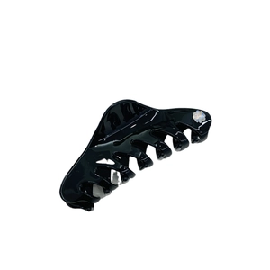Glossy black acetate hair claw clip with pearl flower detail for elegant French hairstyles
