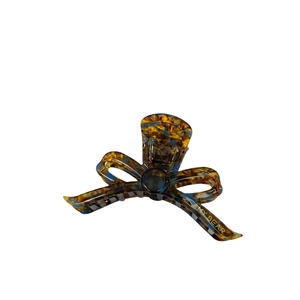 Elegant amber blue patterned acetate bow hair claw clip with golden brand logo