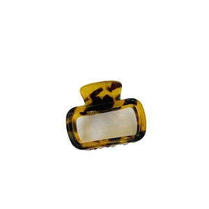 Tortoiseshell acetate square hair claw clip with vintage leopard texture on white background