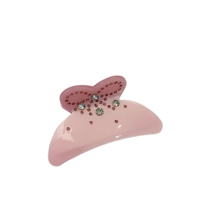 Pince à cheveux papillon rose en acétate avec strass scintillants et finition résine