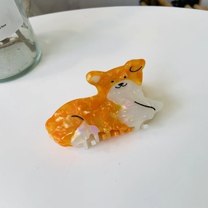 Pince à cheveux corgi en acétate avec texture marbrée orange et blanche pour femme
