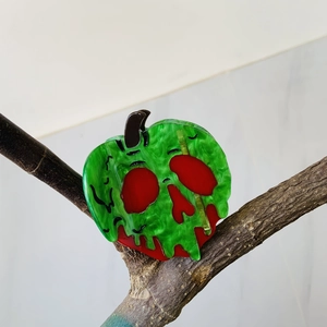 Halloween acetate hair claw clip featuring a green marble poison apple skull design