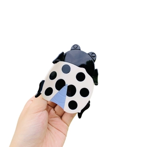 Pince à cheveux coccinelle mignonne à pois noir et blanc pour queue de cheval