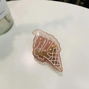 Pince à cheveux glace en acétate scintillante avec paillettes dorées et décor crème