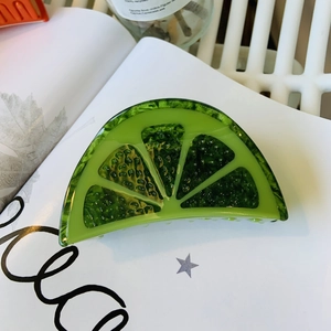 Lime green acetate shark hair claw clip with realistic translucent citrus fruit texture