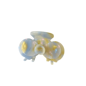 Molla per capelli camelia in acetato con motivo marmorizzato blu e giallo