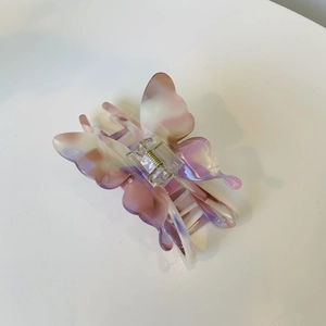 Pince à cheveux papillon élégante en acétate avec motif de marbre rose et crème