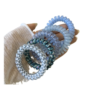 Five-piece blue spiral telephone cord hair tie set with floral and checkered patterns