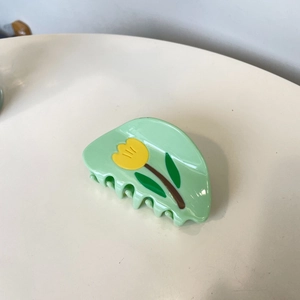 Macaron green acetate hair claw clip featuring yellow tulip patterns in a French style