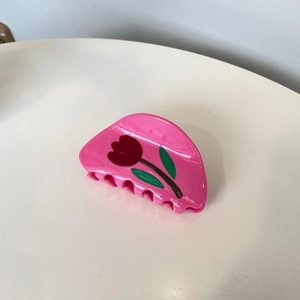 Pink acetate hair claw clip featuring a red tulip floral pattern for women's hairstyling