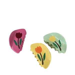 Three-piece French tulip acetate claw clips in pink, yellow and mint green colors