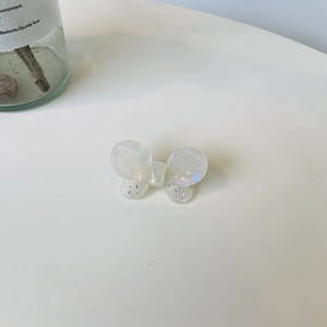 Elegant white acetate butterfly hair clip with rhinestone accents and SANSHINE logo