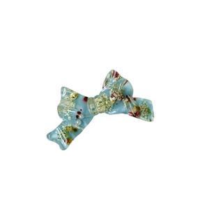 Blue resin bow hair clip with embedded dried flowers and sweet floral aesthetic