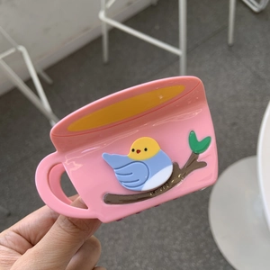 Pink coffee cup hair claw clip with cute bird design and 3D branch detail for women