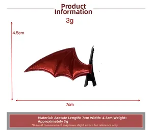 Detail view of red bat wing hair clip with dimensions 7cm by 4.5cm on white background