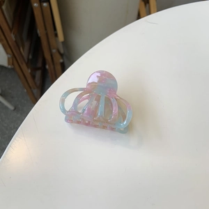 Pink and blue marble texture acetate octopus hair claw clip with Creation France logo