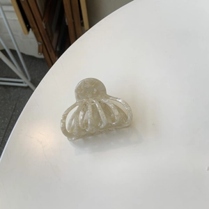 Acetate pumpkin hair claw clip in marble cream color with Creation France lettering