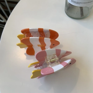 Cute clownfish hair claw clips in orange and pink cream colors with acetate finish