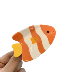 Cute acetate clownfish hair claw clip featuring bright orange and white ocean animal design