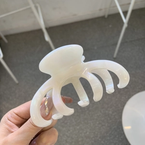 Elegant ivory acetate octopus hair claw clip with golden label for thick hair styling