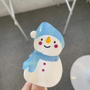 Cute snowman-shaped acetate hair claw clip with blue hat and scarf winter hair accessory