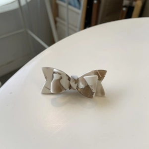 Elegant acetate marble bow hair clip with France Handmade text in cream and brown