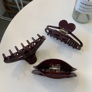 Three-piece deep burgundy hair claw set with heart design and smooth glossy finish