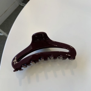 Dark burgundy acetate shark hair claw clip in perfume bottle design for high ponytail