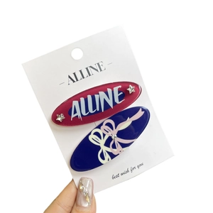 Set of two stylish oval hair clips in wine red and navy blue with cute bow patterns
