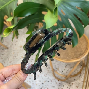 Elegant hollow acetate shark hair claw clip with dark marble pattern for long hair styling