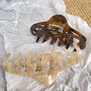 Set of two large acetate hair claws in tortoiseshell and iridescent cream finishes