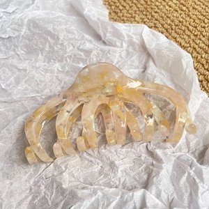 Elegant oversized acetate claw clip with champagne marble texture for thick hair